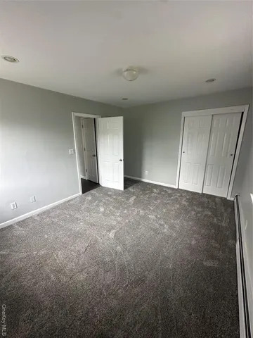 a view of an empty room and entryway