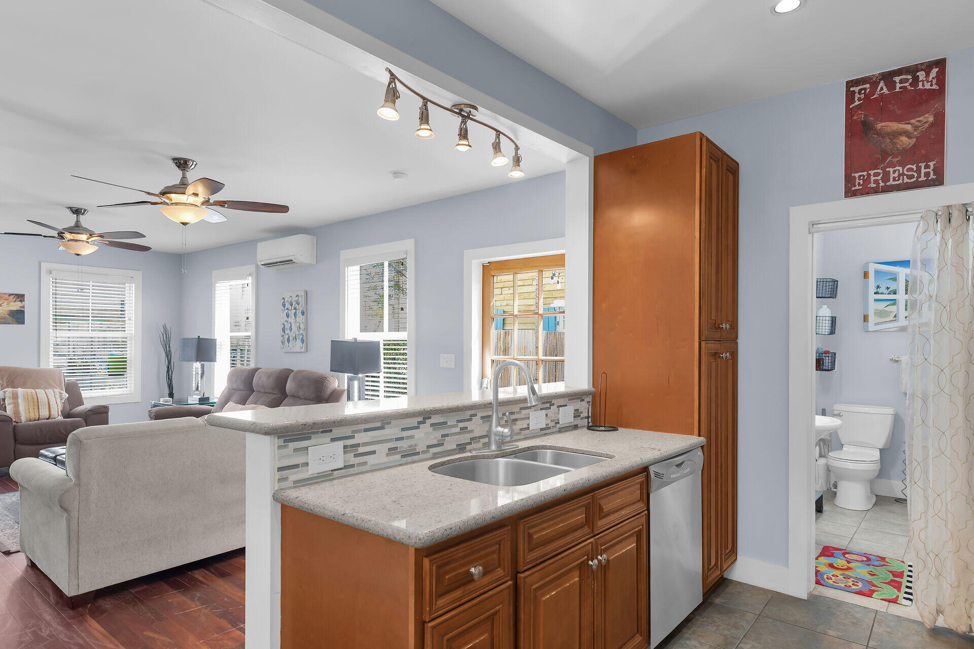 1124 Eaton Street Key West, FL 33040 - Photo 11 of 28 a kitchen with a sink stove and a dining table