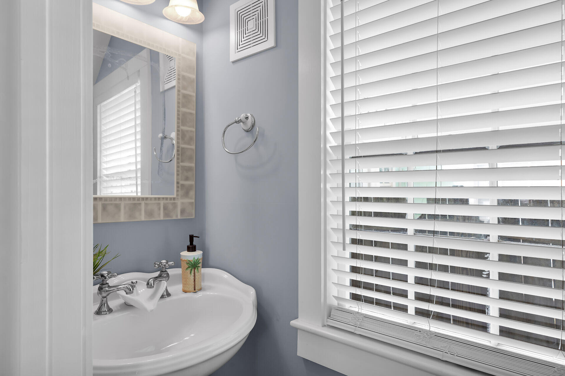 1124 Eaton Street Key West, FL 33040 - Photo 13 of 28 a bathroom with a sink and a mirror