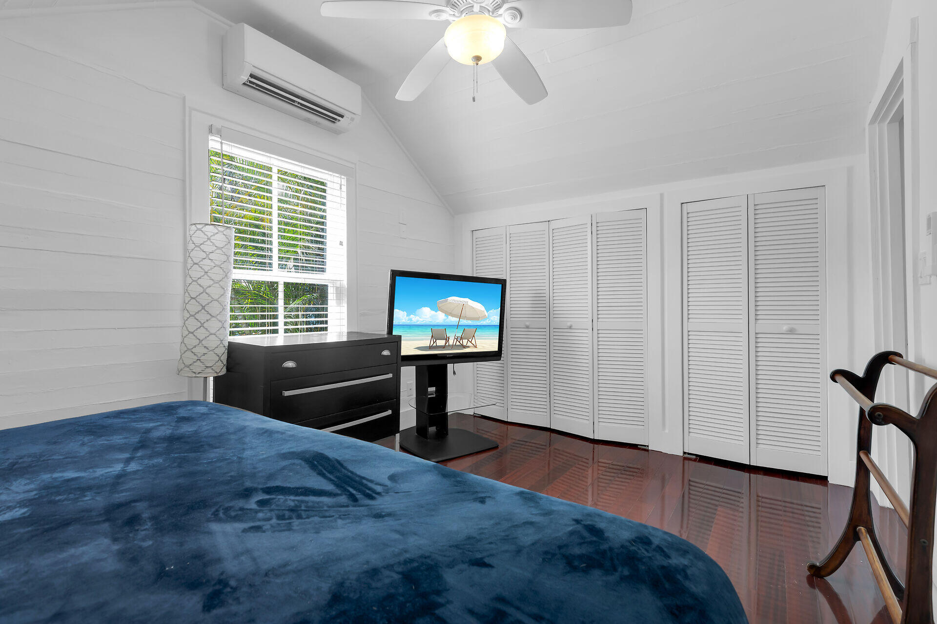 1124 Eaton Street Key West, FL 33040 - Photo 17 of 28 a view of an empty room with a window and wooden floor