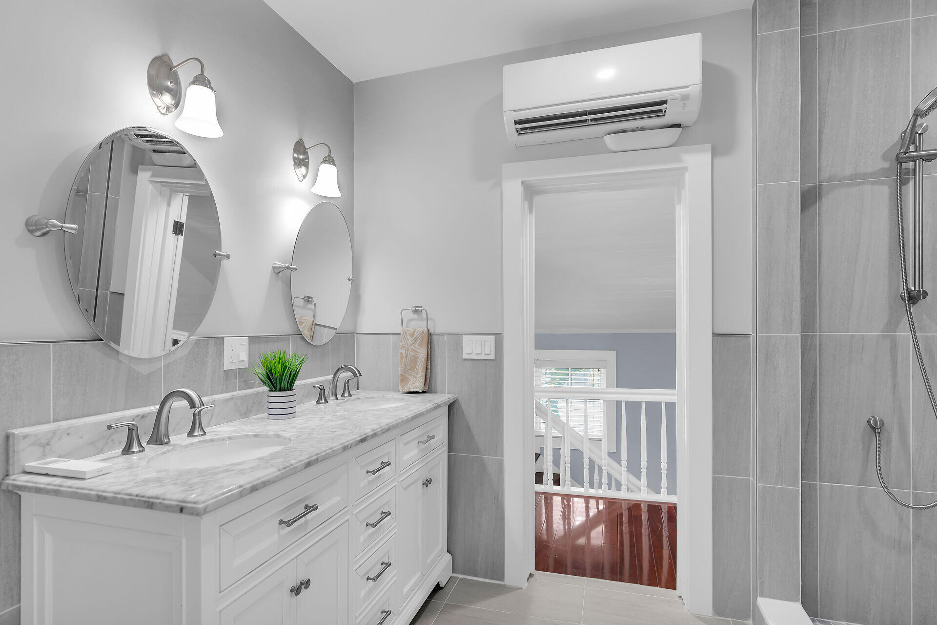 1124 Eaton Street Key West, FL 33040 - Photo 20 of 28 a en suite bathroom with a granite countertop sink and a mirror