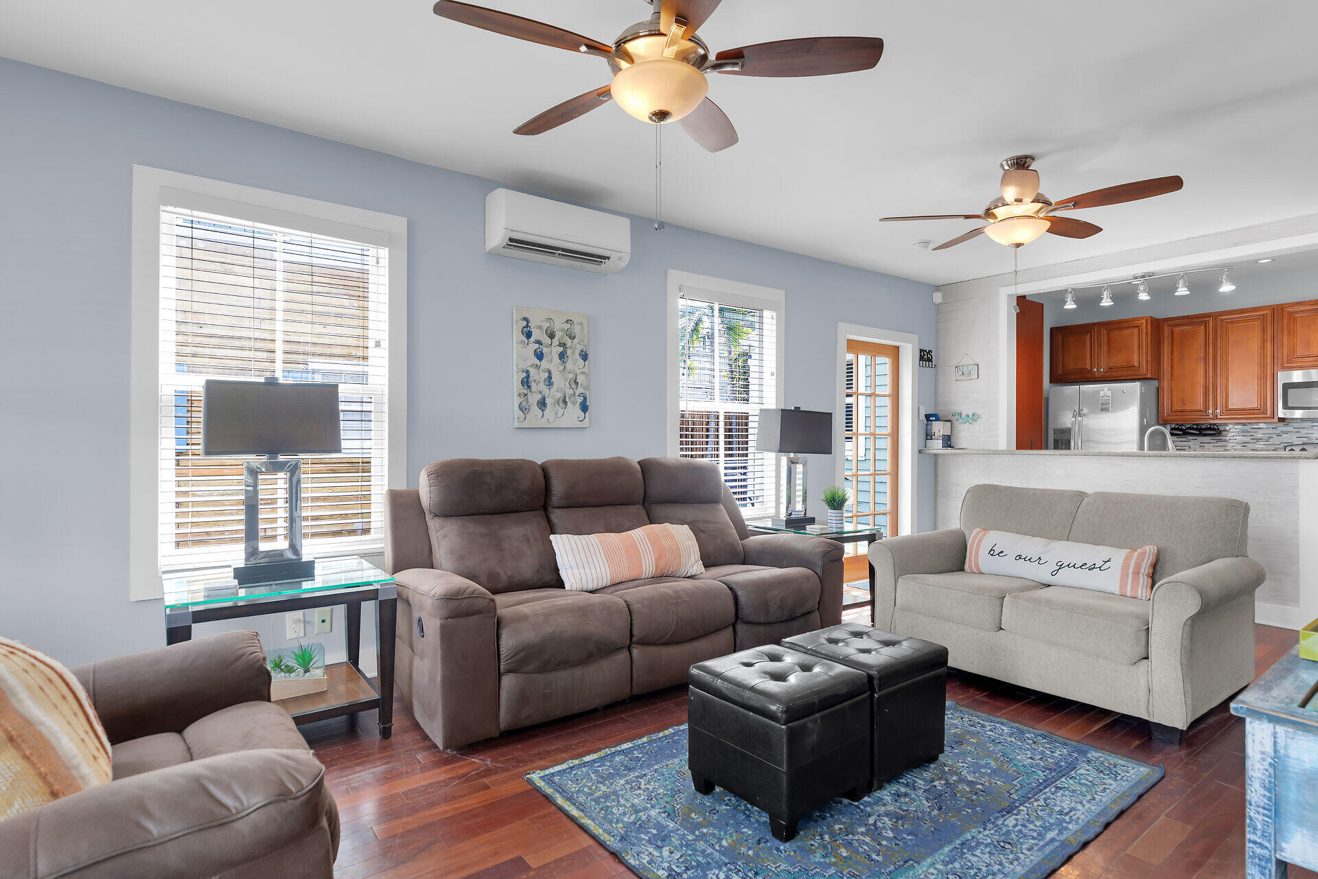 1124 Eaton Street Key West, FL 33040 - Photo 5 of 28 a living room with furniture a ceiling fan a lamp and a window