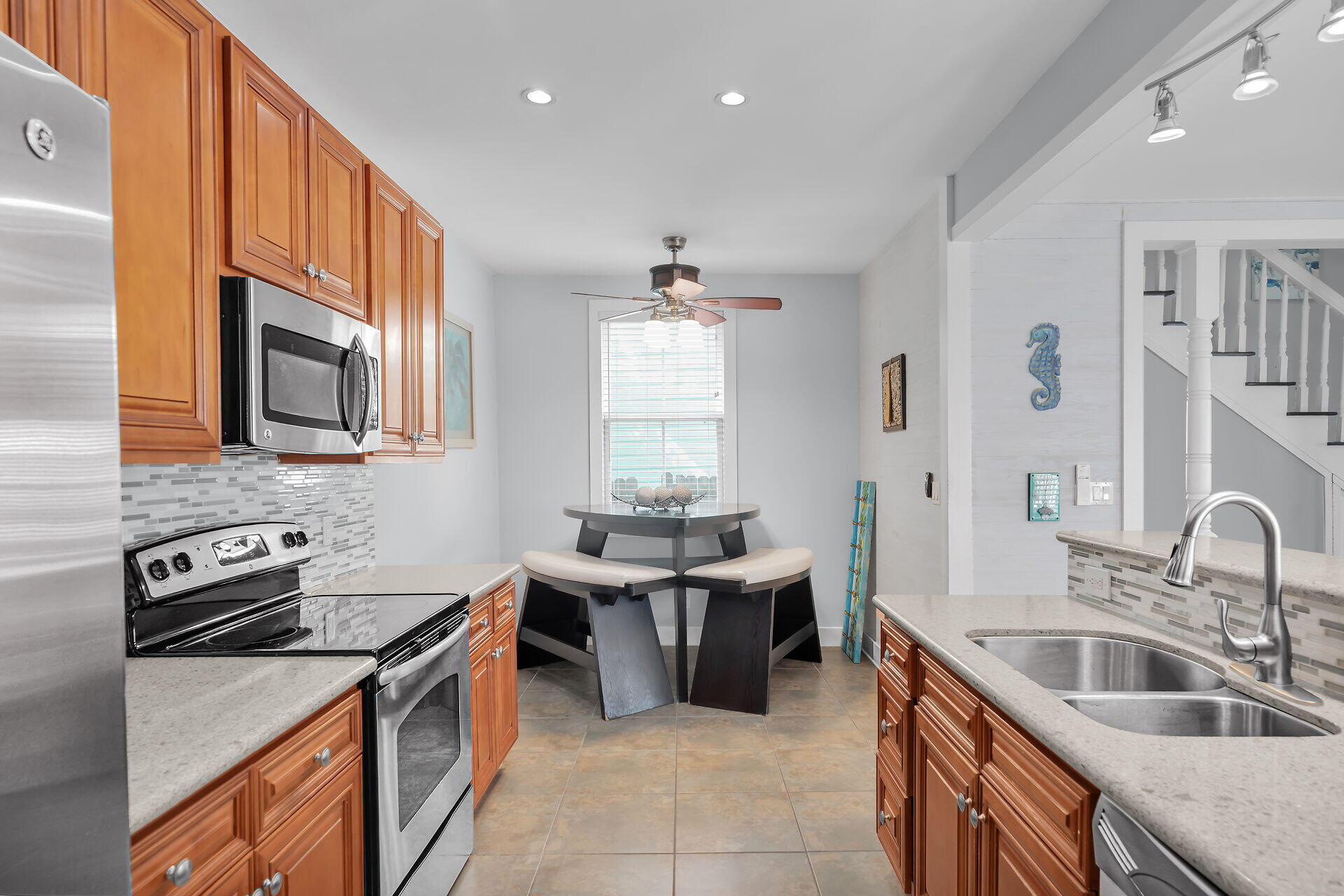 1124 Eaton Street Key West, FL 33040 - Photo 9 of 28 a kitchen with stainless steel appliances granite countertop a sink stove and refrigerator