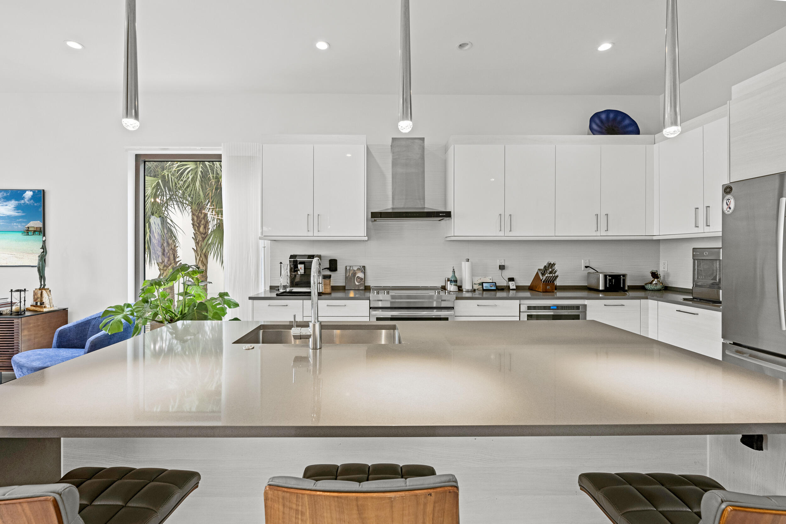 1811 Northwest 42nd Drive Boca Raton, FL 33431 - Photo 14 of 52 a kitchen with a sink stainless steel appliances and cabinets