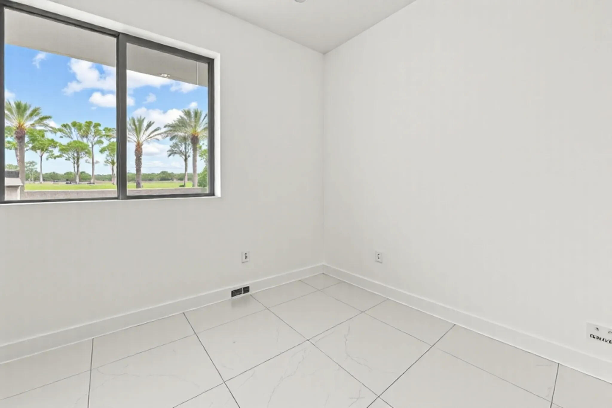 1811 Northwest 42nd Drive Boca Raton, FL 33431 - Photo 17 of 52 an empty room with a window