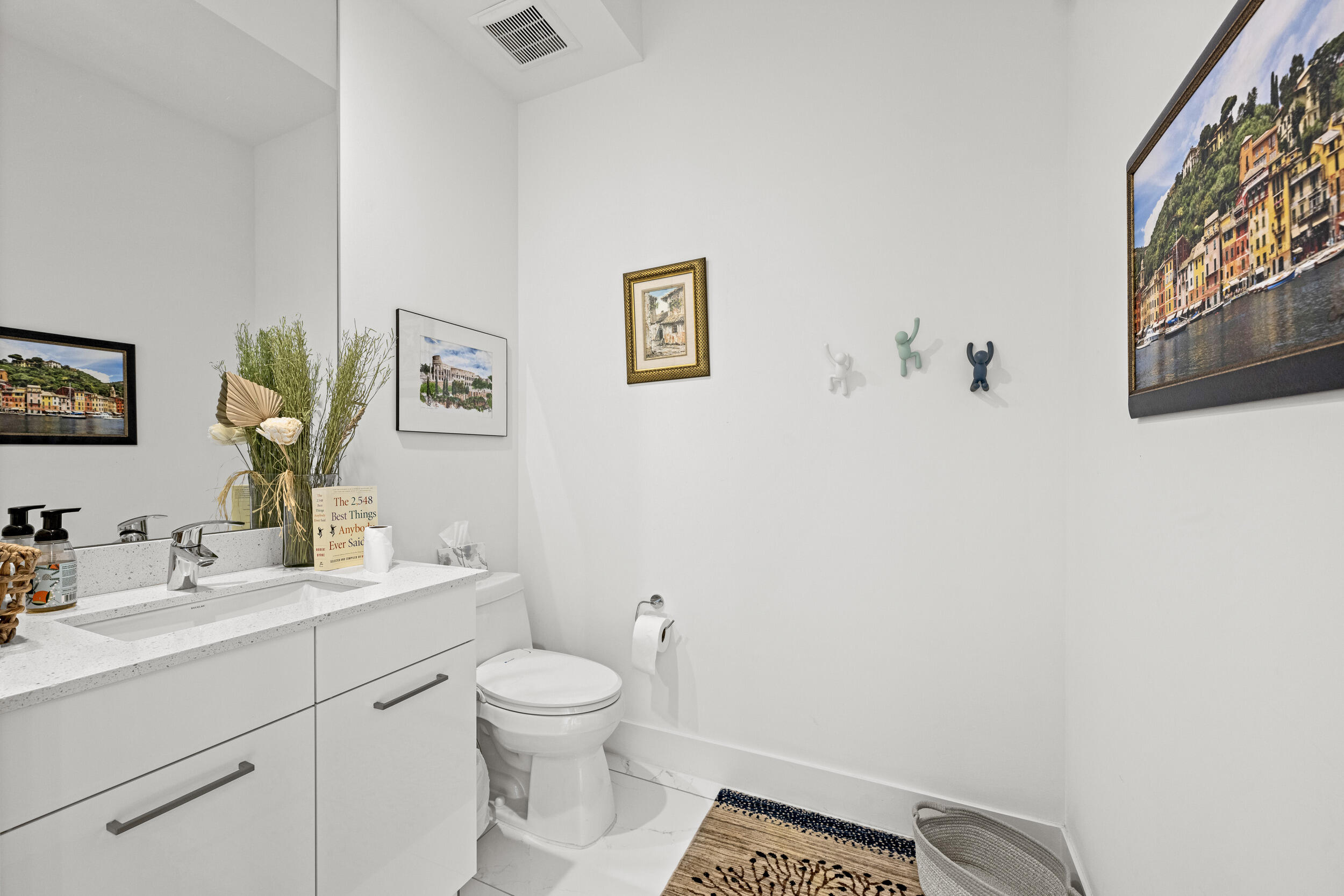 1811 Northwest 42nd Drive Boca Raton, FL 33431 - Photo 22 of 52 a bathroom with a toilet sink vanity and mirror