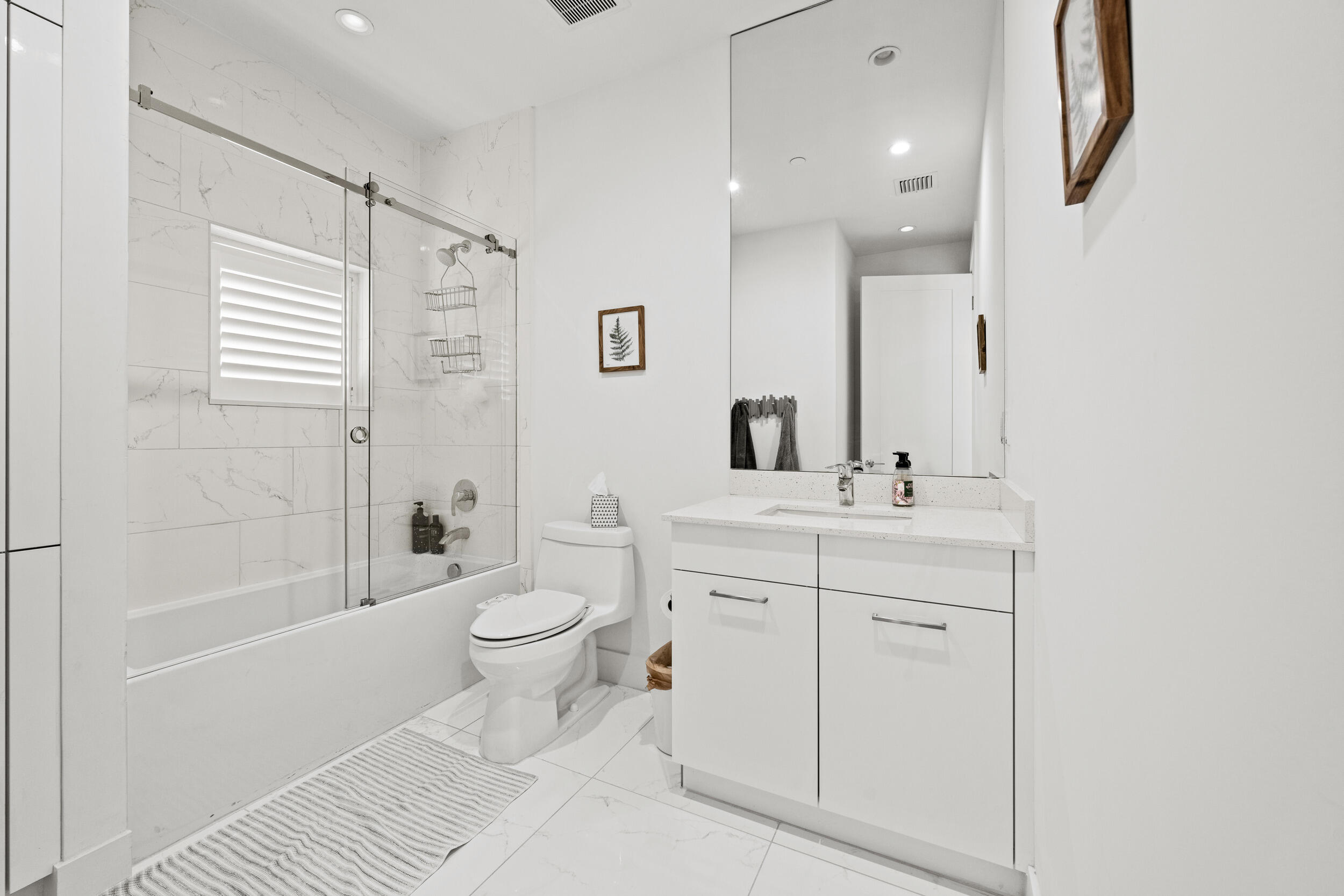 1811 Northwest 42nd Drive Boca Raton, FL 33431 - Photo 28 of 52 a bathroom with a sink a toilet and shower