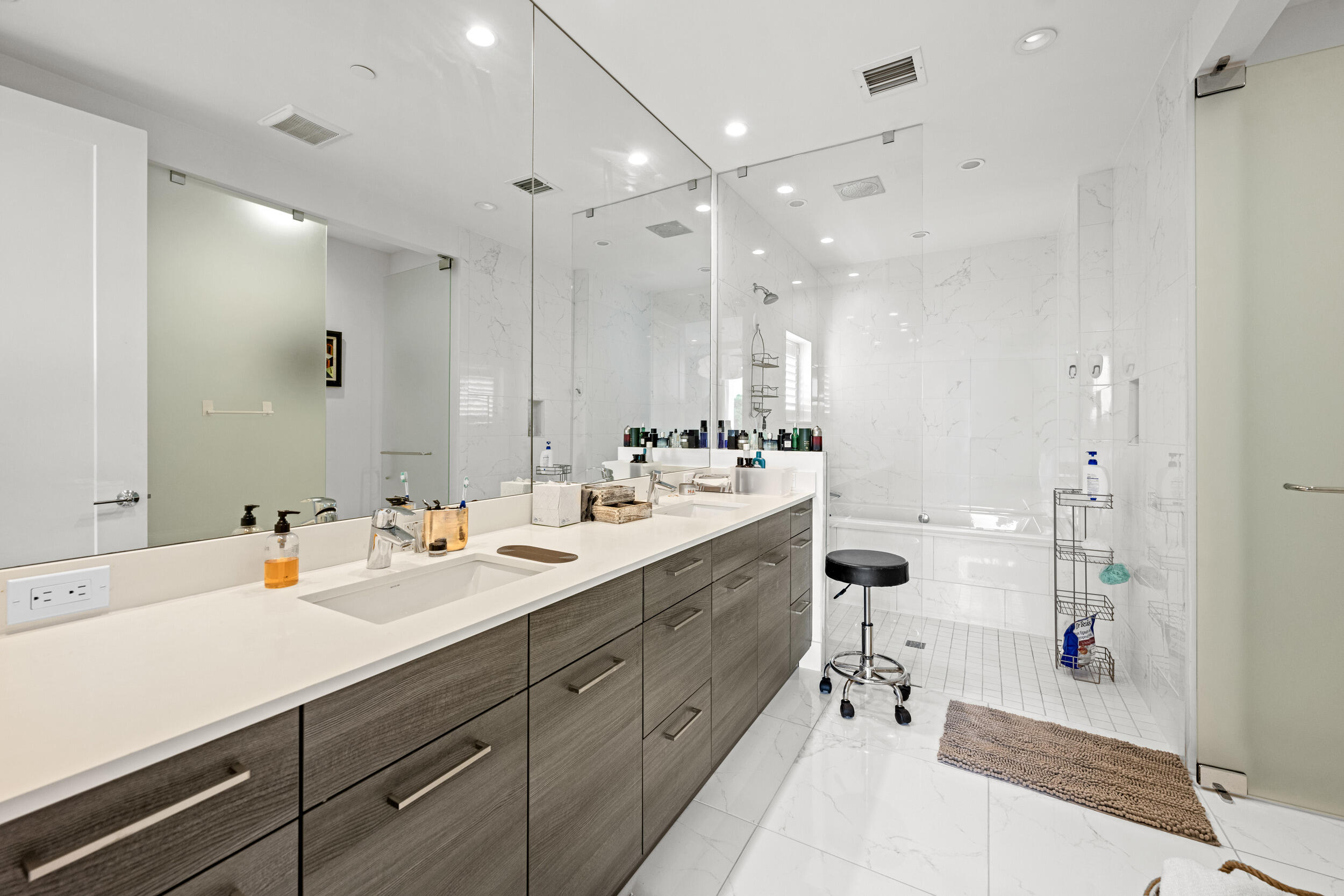 1811 Northwest 42nd Drive Boca Raton, FL 33431 - Photo 32 of 52 a spacious bathroom with a double vanity sink mirror and double