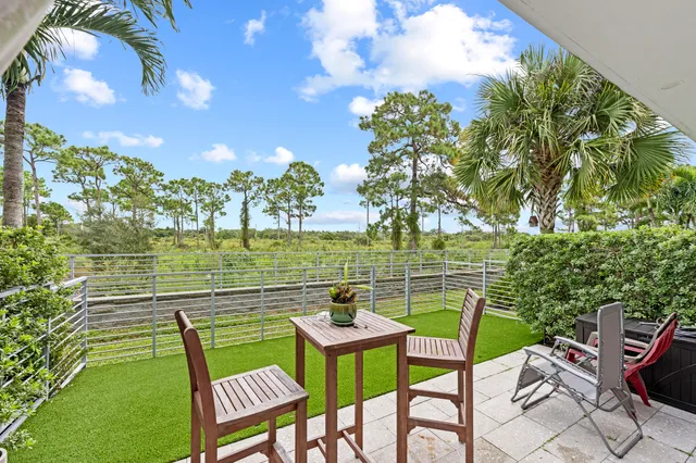 a view of a chairs and table in the patio