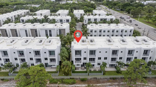 a view of multiple house with a yard