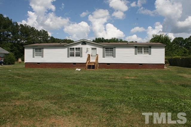 54 Gm Robertson Road Roxboro, NC 27574 - Photo 1 of 17 a front view of a house with yard
