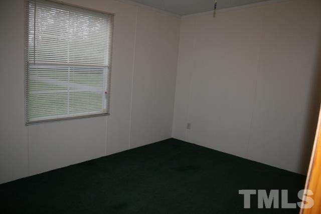 54 Gm Robertson Road Roxboro, NC 27574 - Photo 14 of 17 a view of an empty room with a window