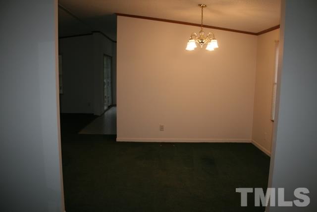 54 Gm Robertson Road Roxboro, NC 27574 - Photo 4 of 17 a view of a small space with wooden floor and a window
