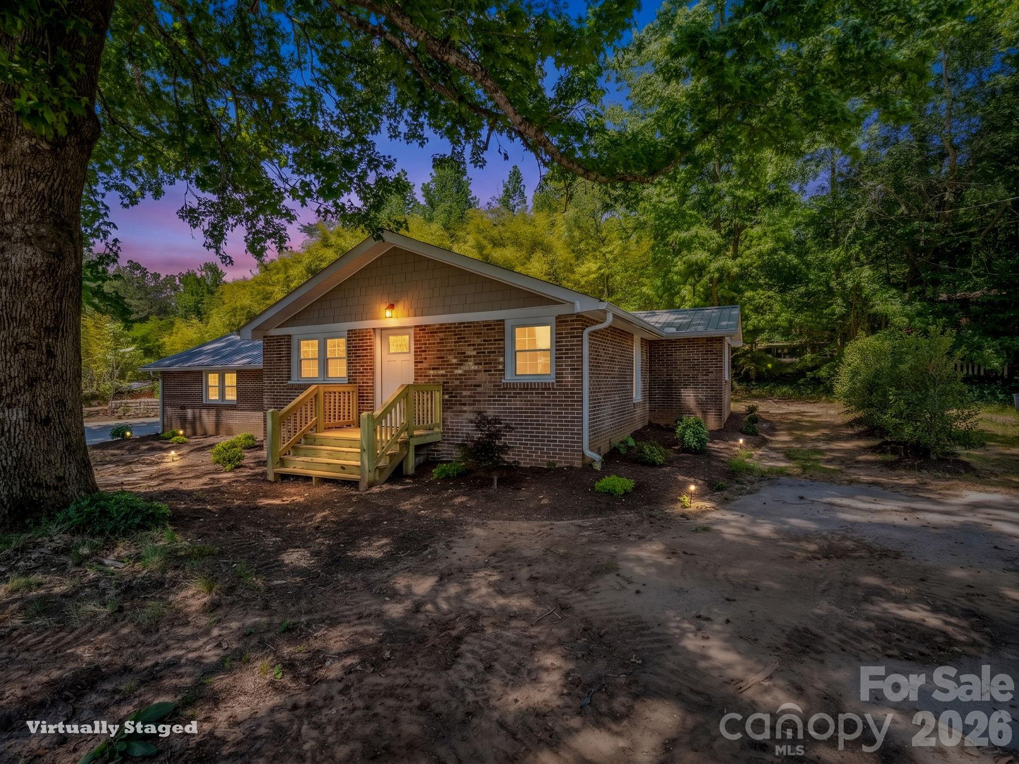5923 Highway 14 Landrum, SC 29356 - Photo 1 of 15 a view of a house with a yard