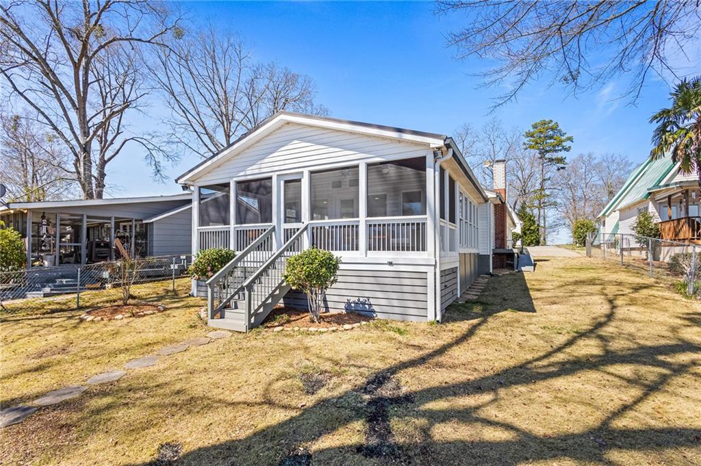 232 Arrow Point Road Jackson, GA 30233 - Photo 1 of 1 a front view of a house with a yard