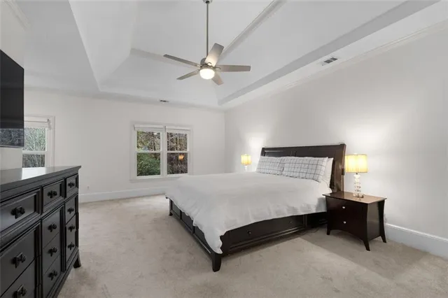 a view of a house with swimming pool and sitting area