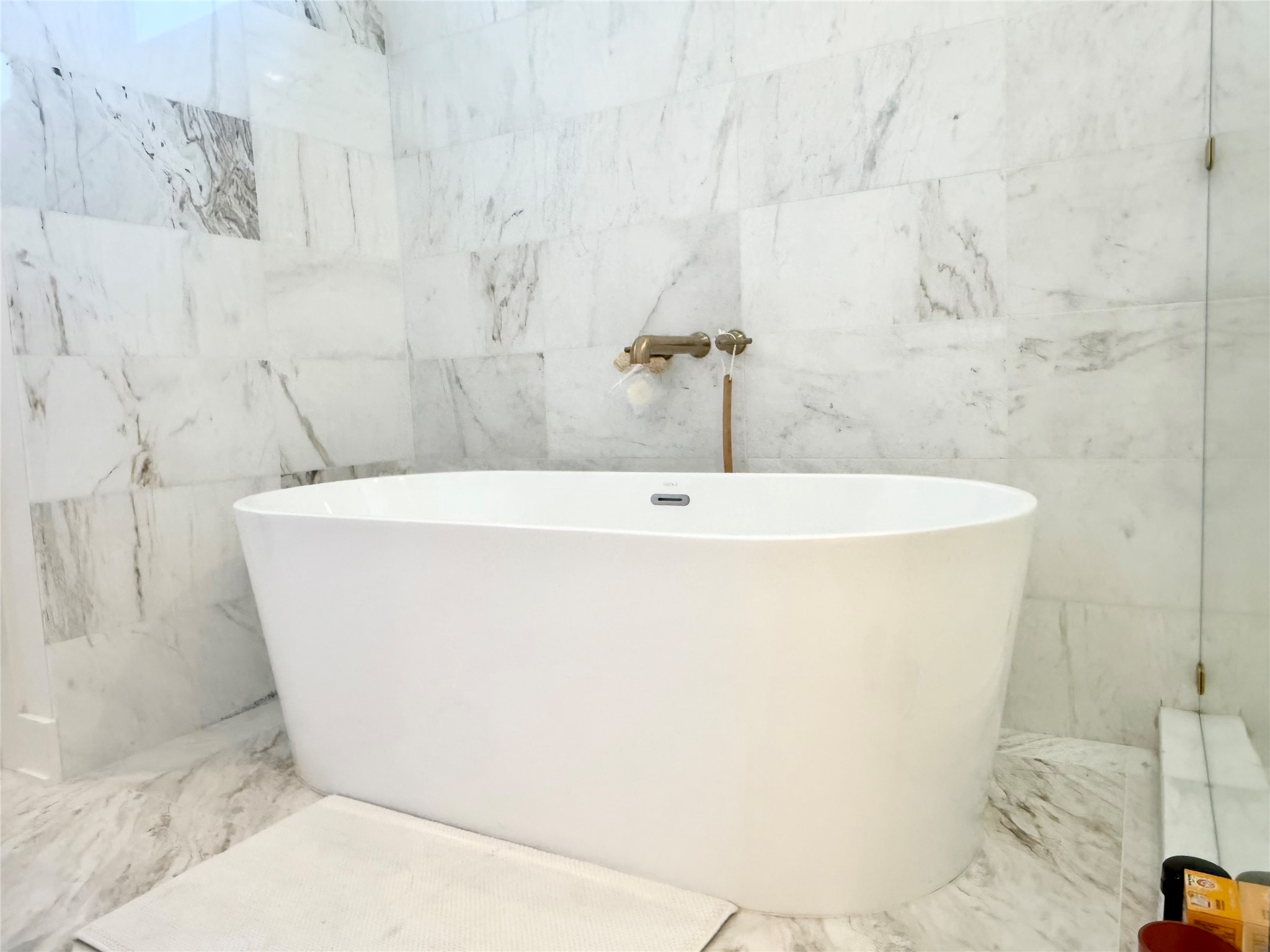 2015 De Verne Street Austin, TX 78704 - Photo 12 of 21 Bathroom with tile walls and a freestanding bath