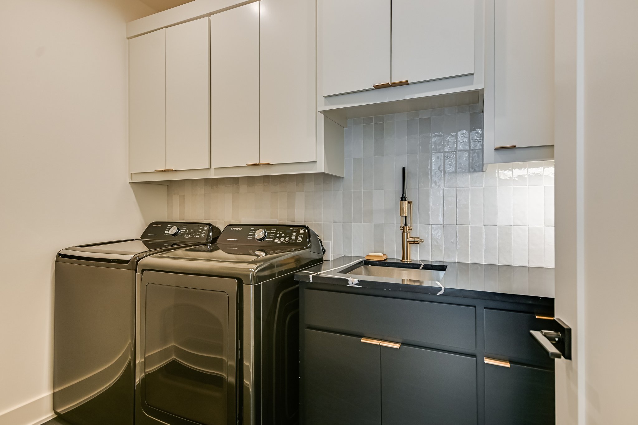 2015 De Verne Street Austin, TX 78704 - Photo 13 of 21 Laundry room featuring cabinet space and separate washer and dryer