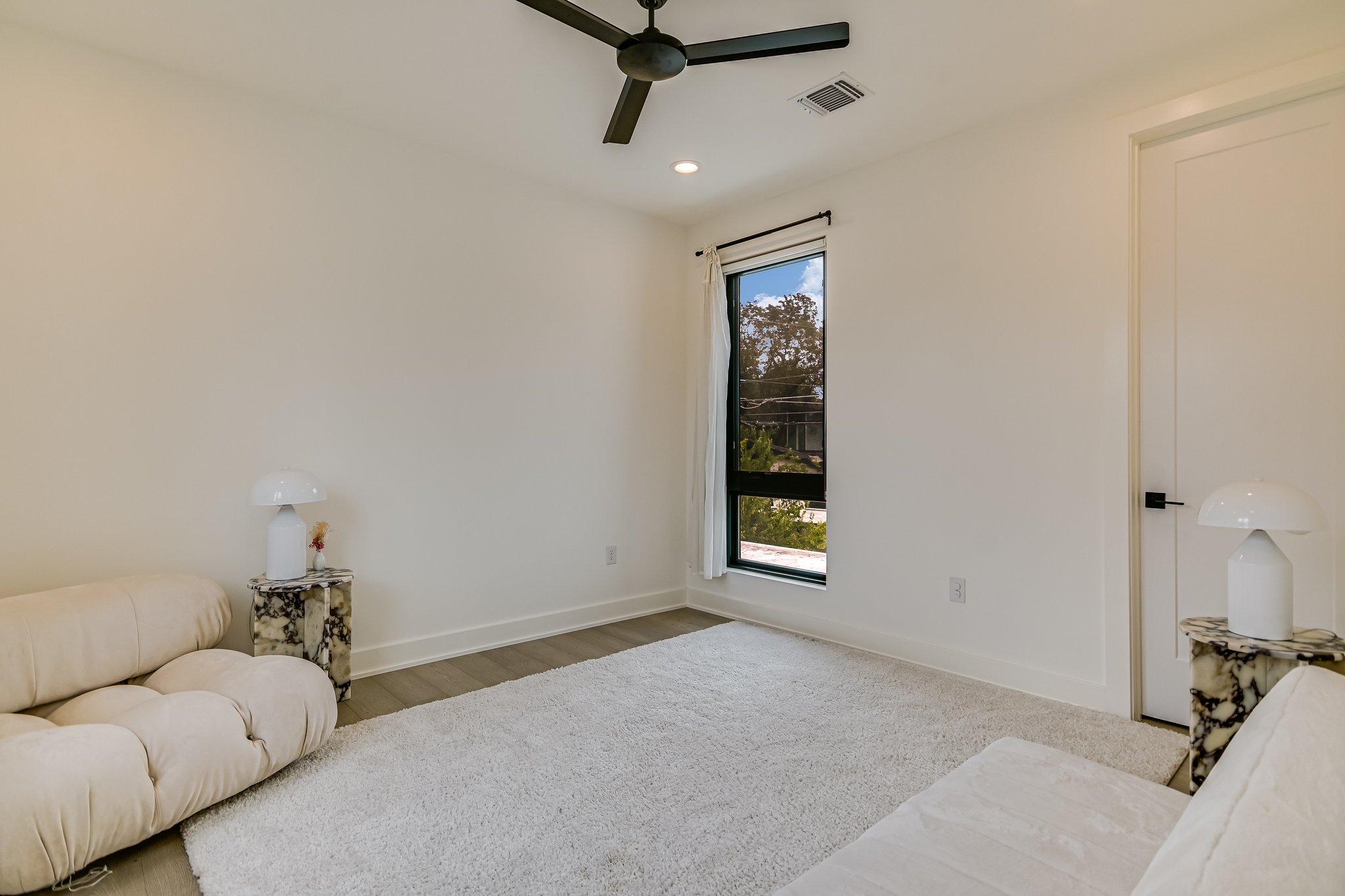 2015 De Verne Street Austin, TX 78704 - Photo 16 of 21 Sitting room featuring a ceiling fan, recessed lighting, and wood finished floors