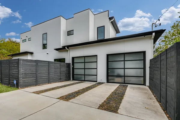 a front view of a house with a garage