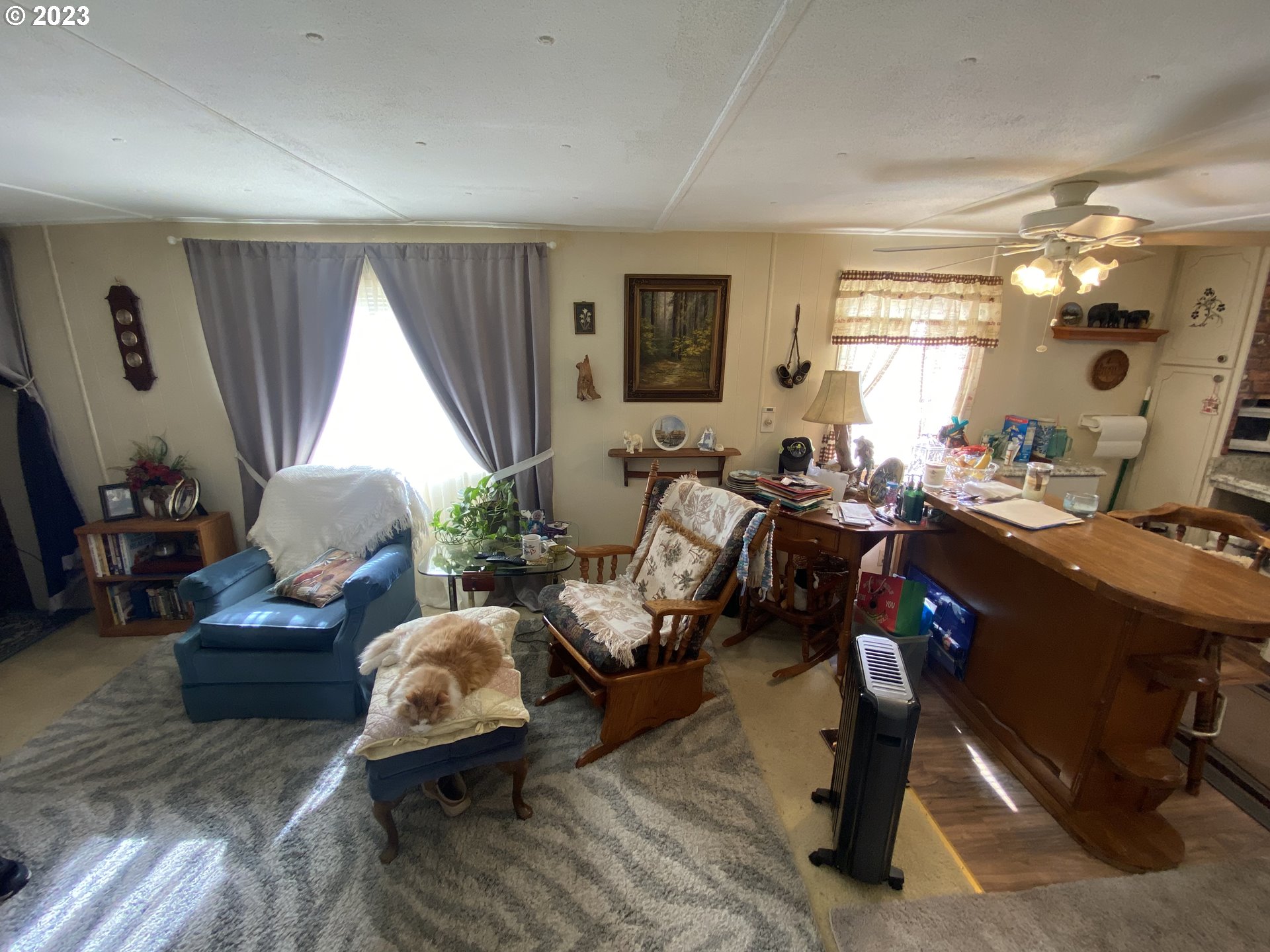 3900 Coburg Road, Unit 52 Eugene, OR 97408 - Photo 8 of 17 a living room with furniture and a large window