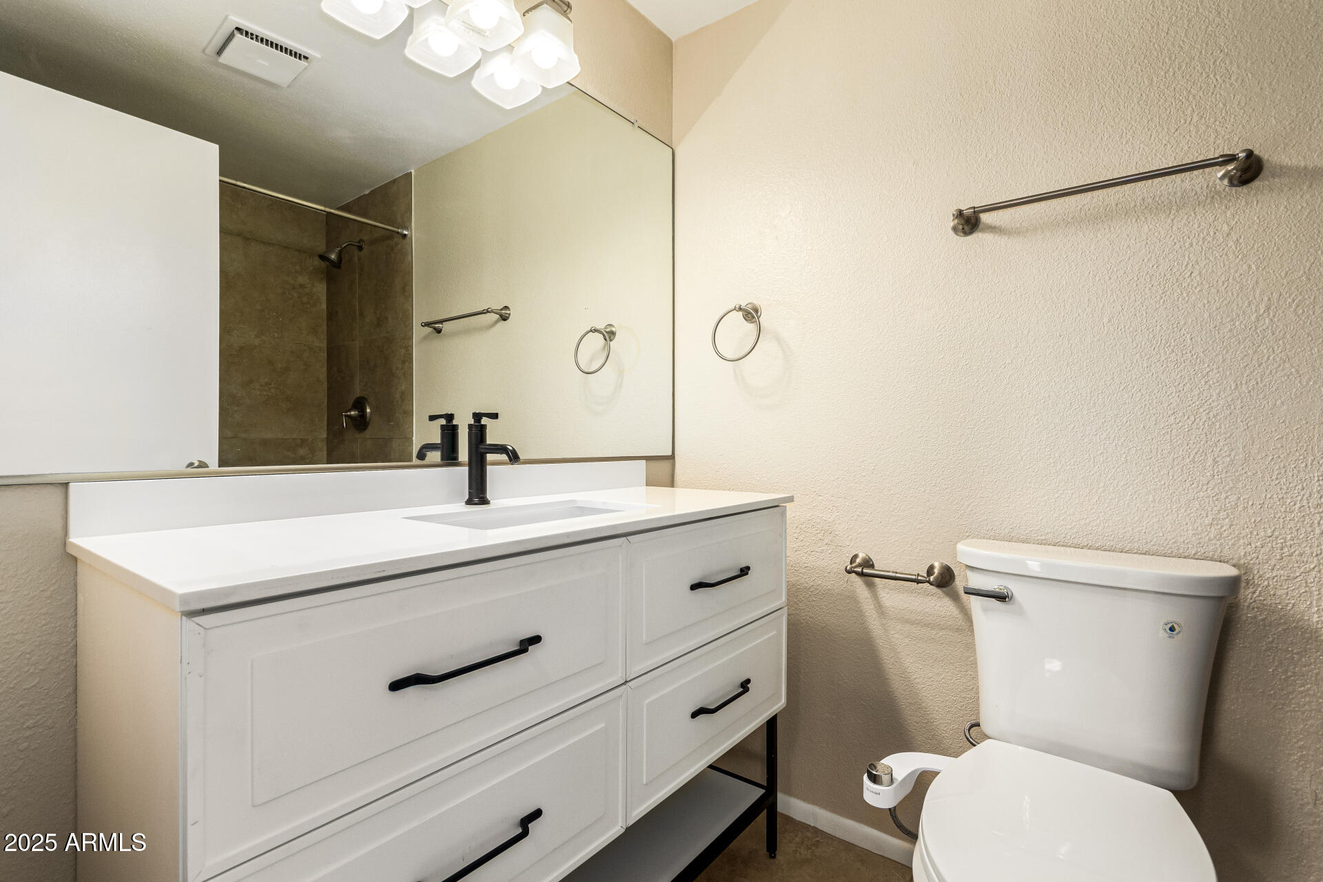 2133 North Apollo Court Chandler, AZ 85224 - Photo 15 of 23 a bathroom with a granite countertop toilet sink and a mirror