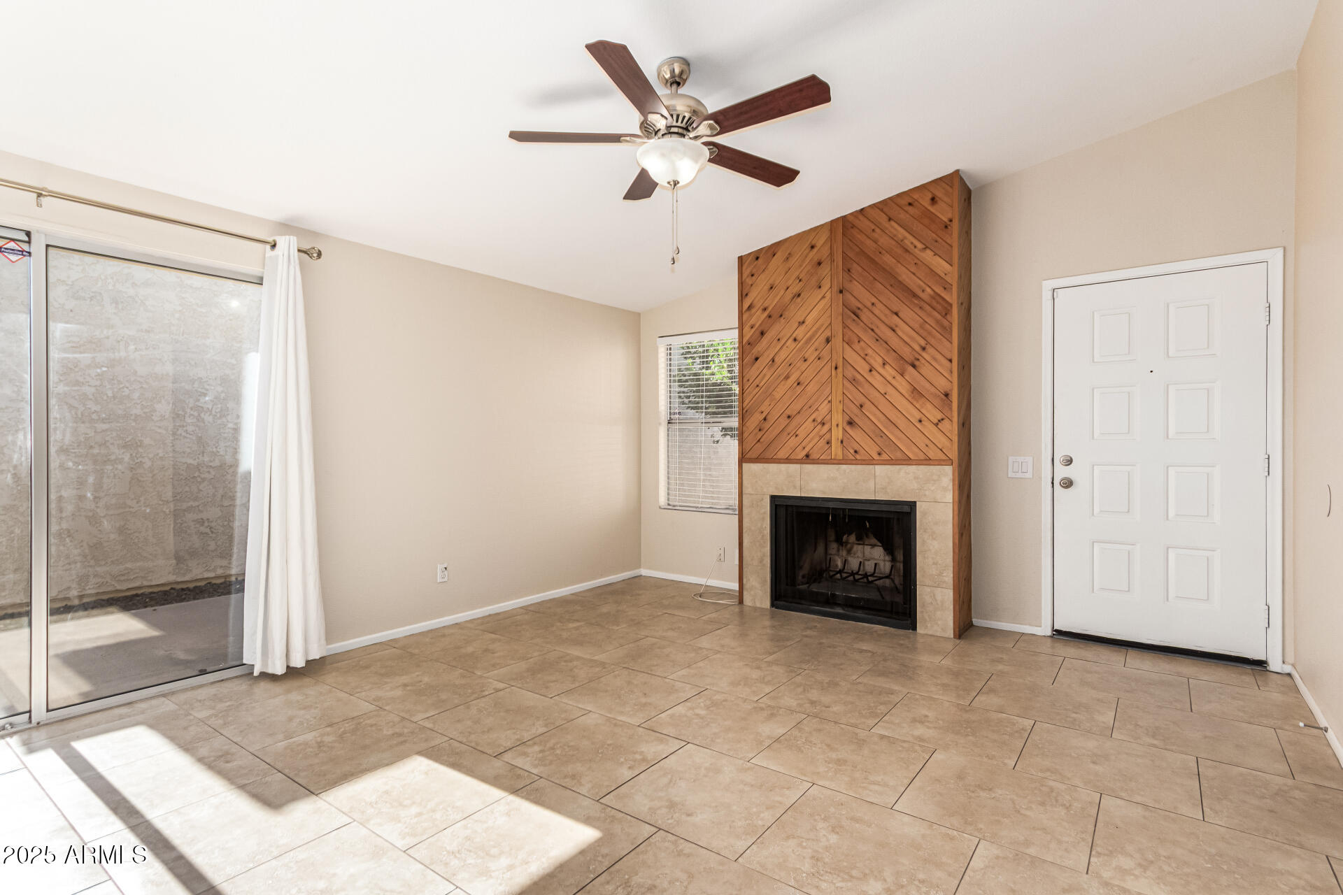 2133 North Apollo Court Chandler, AZ 85224 - Photo 7 of 23 a view of a livingroom with a fireplace and a chandelier fan