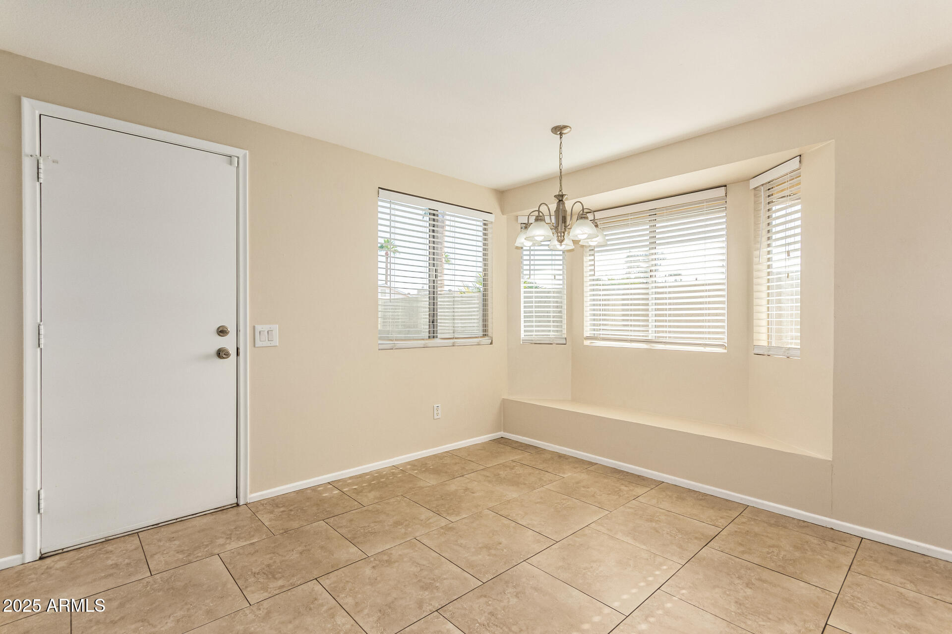 2133 North Apollo Court Chandler, AZ 85224 - Photo 8 of 23 a view of an empty room with a window