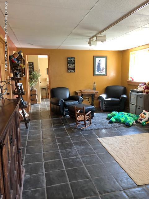 1424 Arabian Avenue Rifle, CO 81650 - Photo 9 of 14 a lobby with furniture and a potted plant