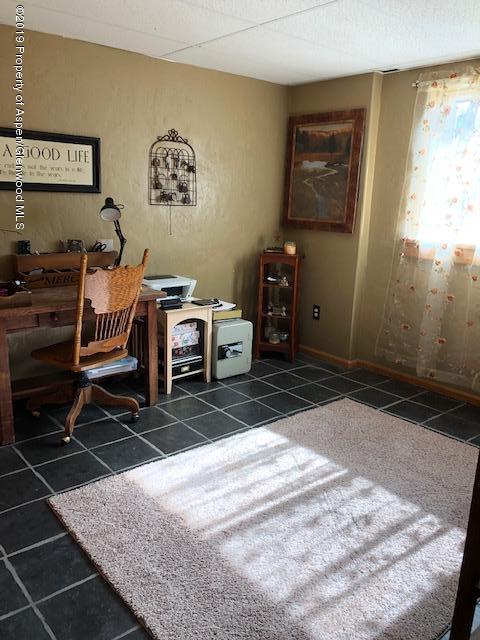 1424 Arabian Avenue Rifle, CO 81650 - Photo 10 of 14 a room with furniture and a window