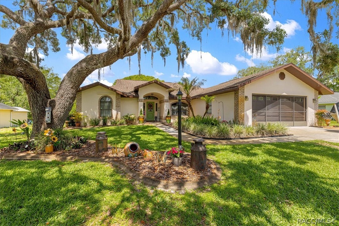 2964 South Cygnet Terrace Inverness, FL 34450 - Photo 62 of 67 a front view of a house with garden