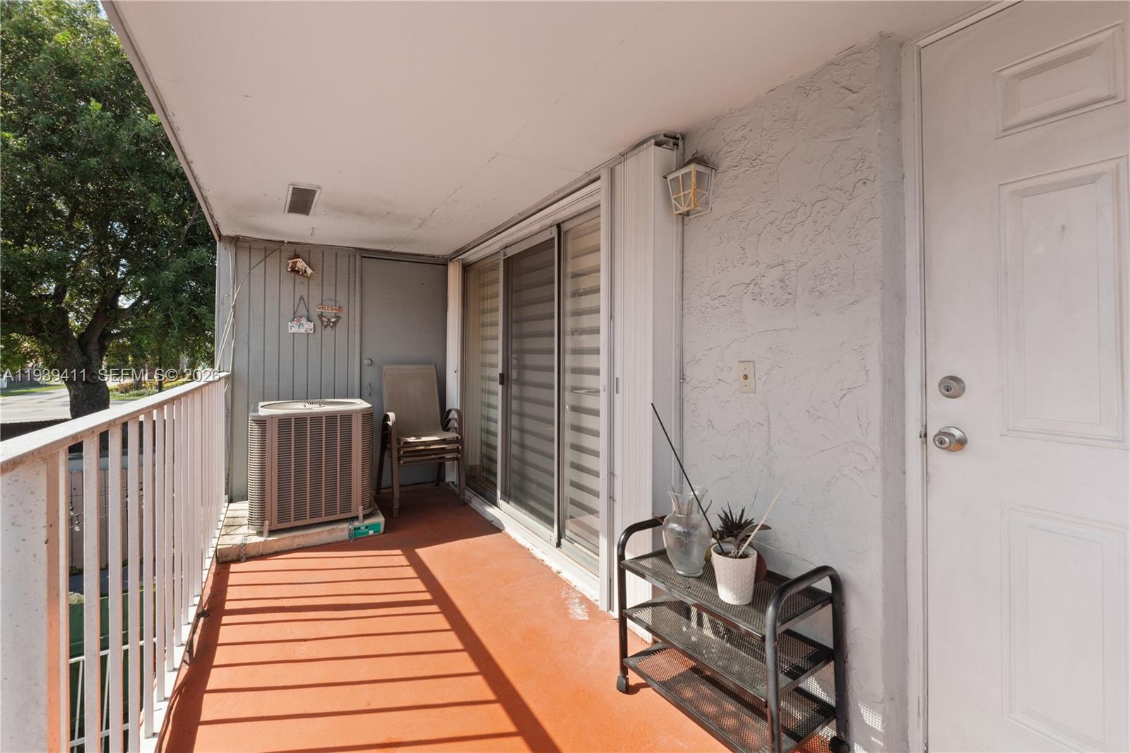 8480 Southwest 156th Place, Unit 620 Miami, FL 33193 - Photo 16 of 23 a view of a balcony with wooden floor