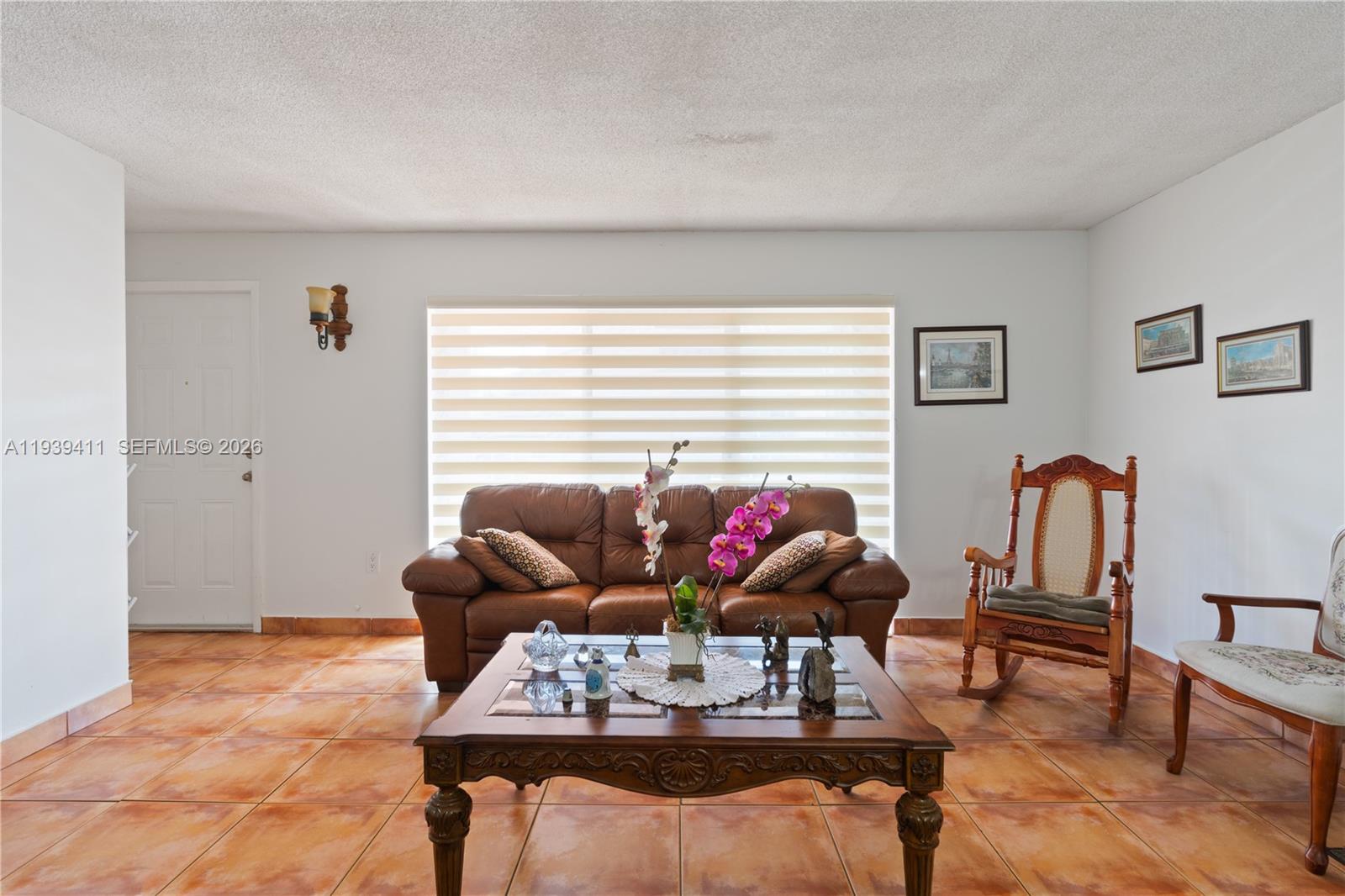 8480 Southwest 156th Place, Unit 620 Miami, FL 33193 - Photo 4 of 23 a living room with furniture and wooden floor