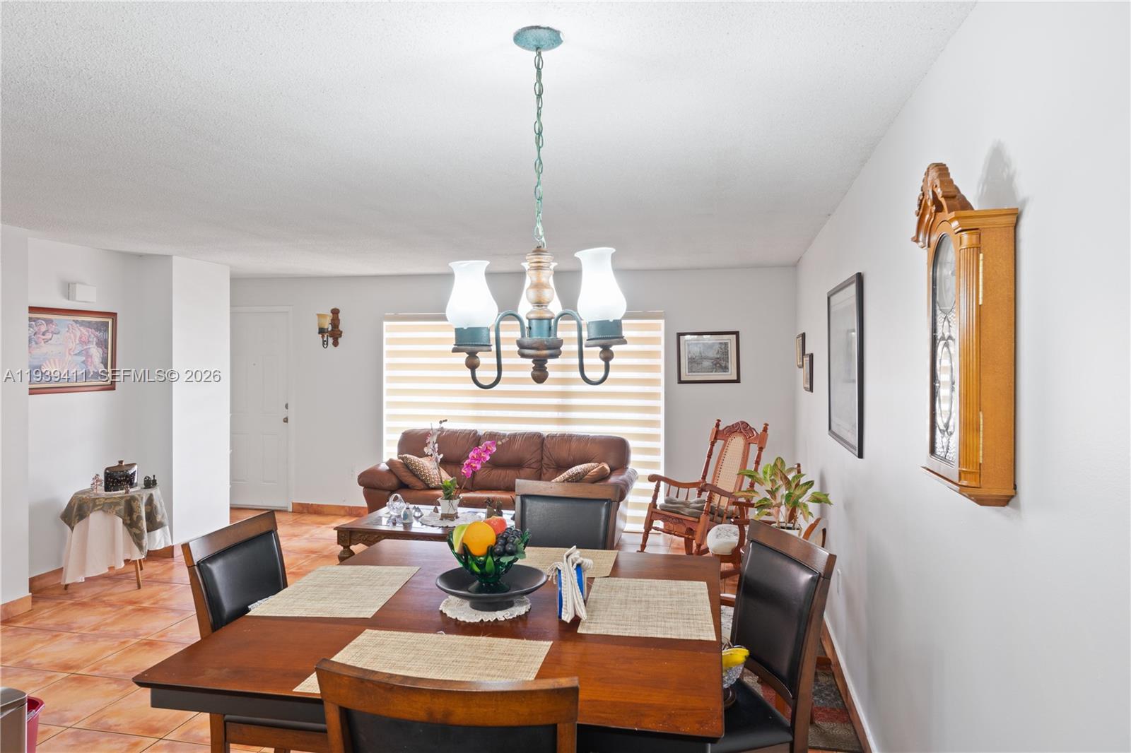 8480 Southwest 156th Place, Unit 620 Miami, FL 33193 - Photo 6 of 23 a view of a dining room with furniture window and wooden floor