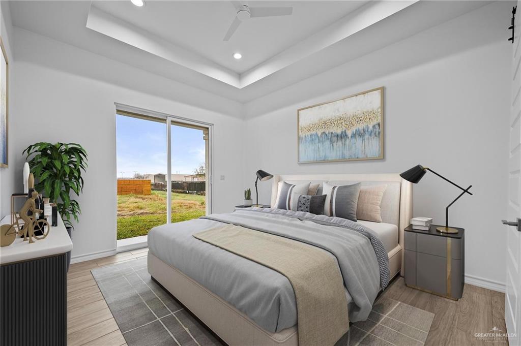 2716 East Conroe Road Edinburg, TX 78542 - Photo 13 of 31 a bed sitting in a bedroom next to a window