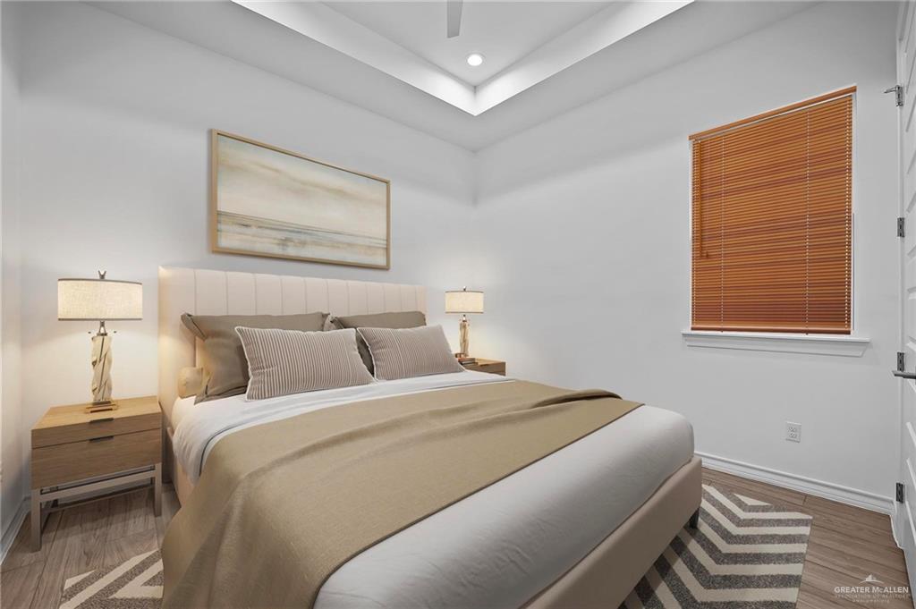 2716 East Conroe Road Edinburg, TX 78542 - Photo 19 of 31 a bedroom with a bed and a painting on the wall