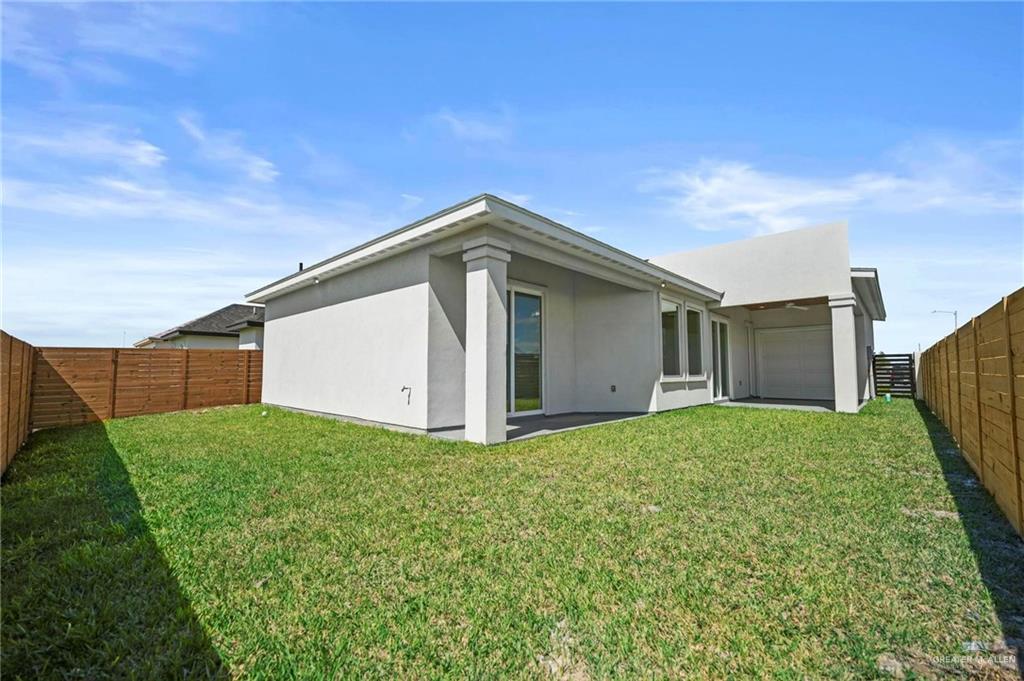 2716 East Conroe Road Edinburg, TX 78542 - Photo 31 of 31 a backyard of a house with lots of green space