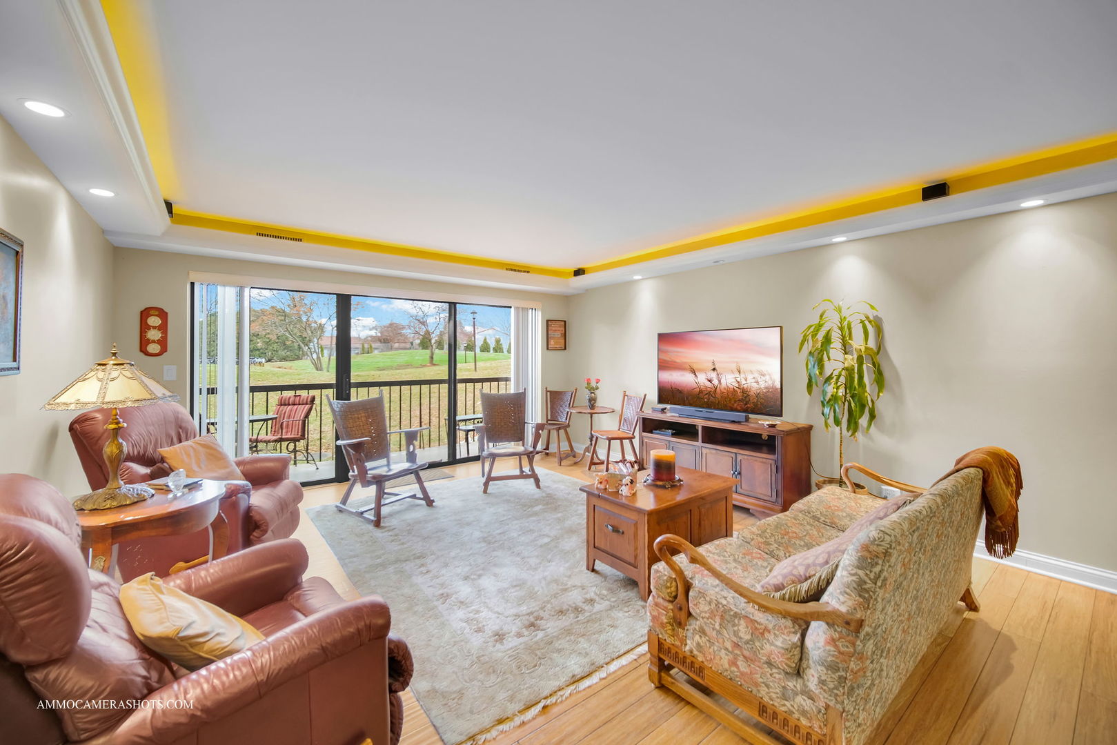 1105 North Mill Street, Unit 117 Naperville, IL 60563 - Photo 2 of 23 a living room with furniture and a flat screen tv