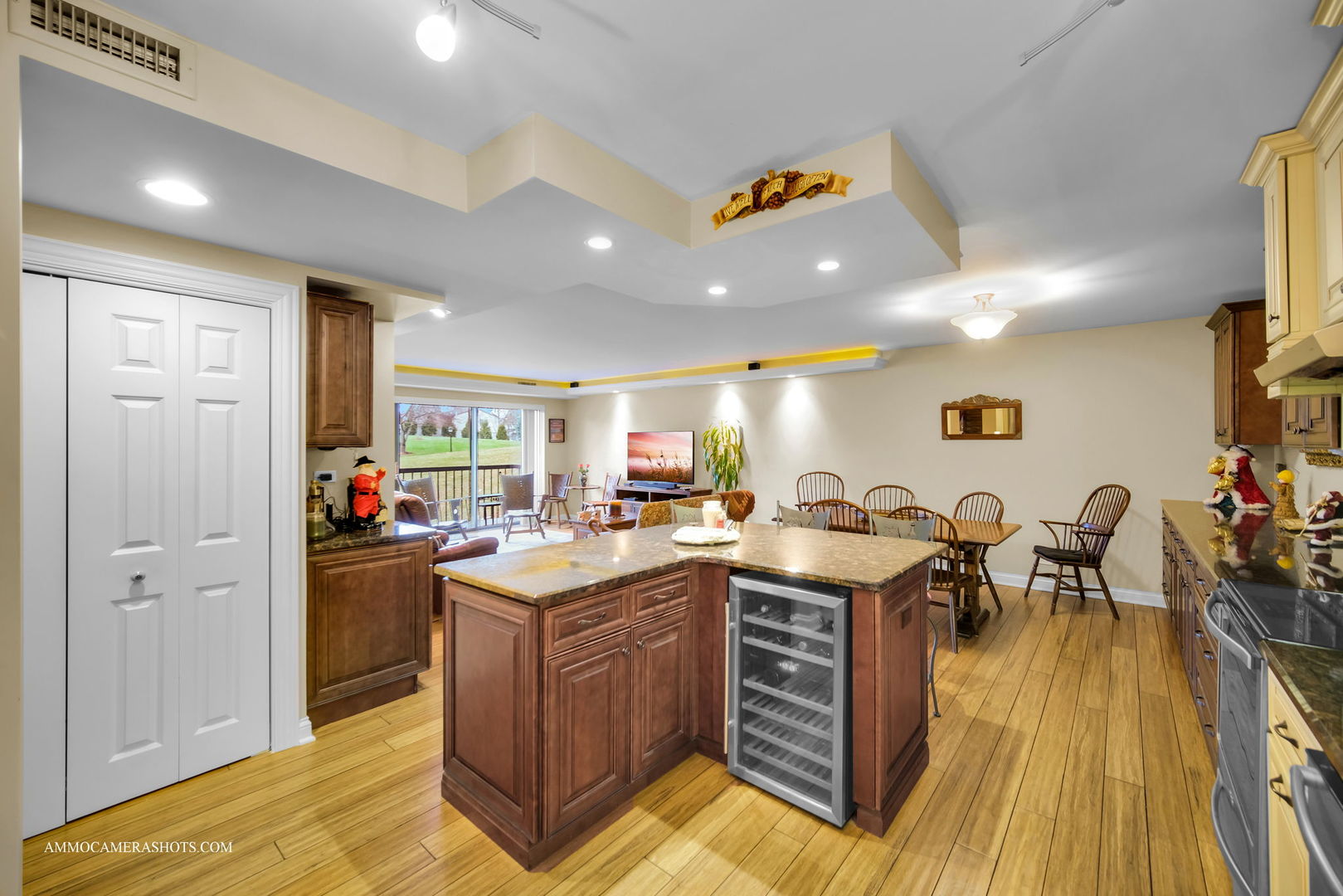 1105 North Mill Street, Unit 117 Naperville, IL 60563 - Photo 9 of 23 a view of a kitchen with furniture and wooden floor