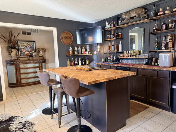 a dining room with a table and chairs