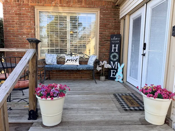 a view of a porch with seating space