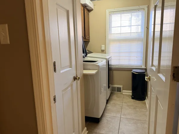 a room with window and washer