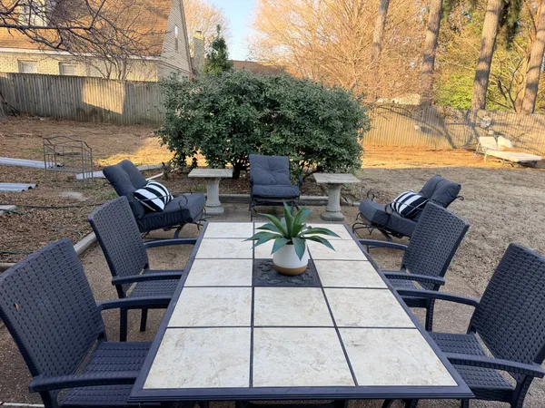 a view of a patio with furniture