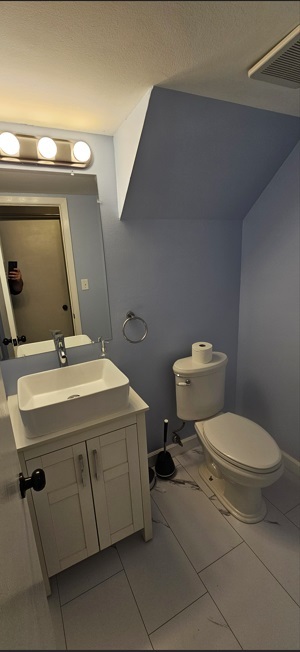 309 Teak Lane Streamwood, IL 60107 - Photo 13 of 16 a bathroom with a toilet sink and mirror