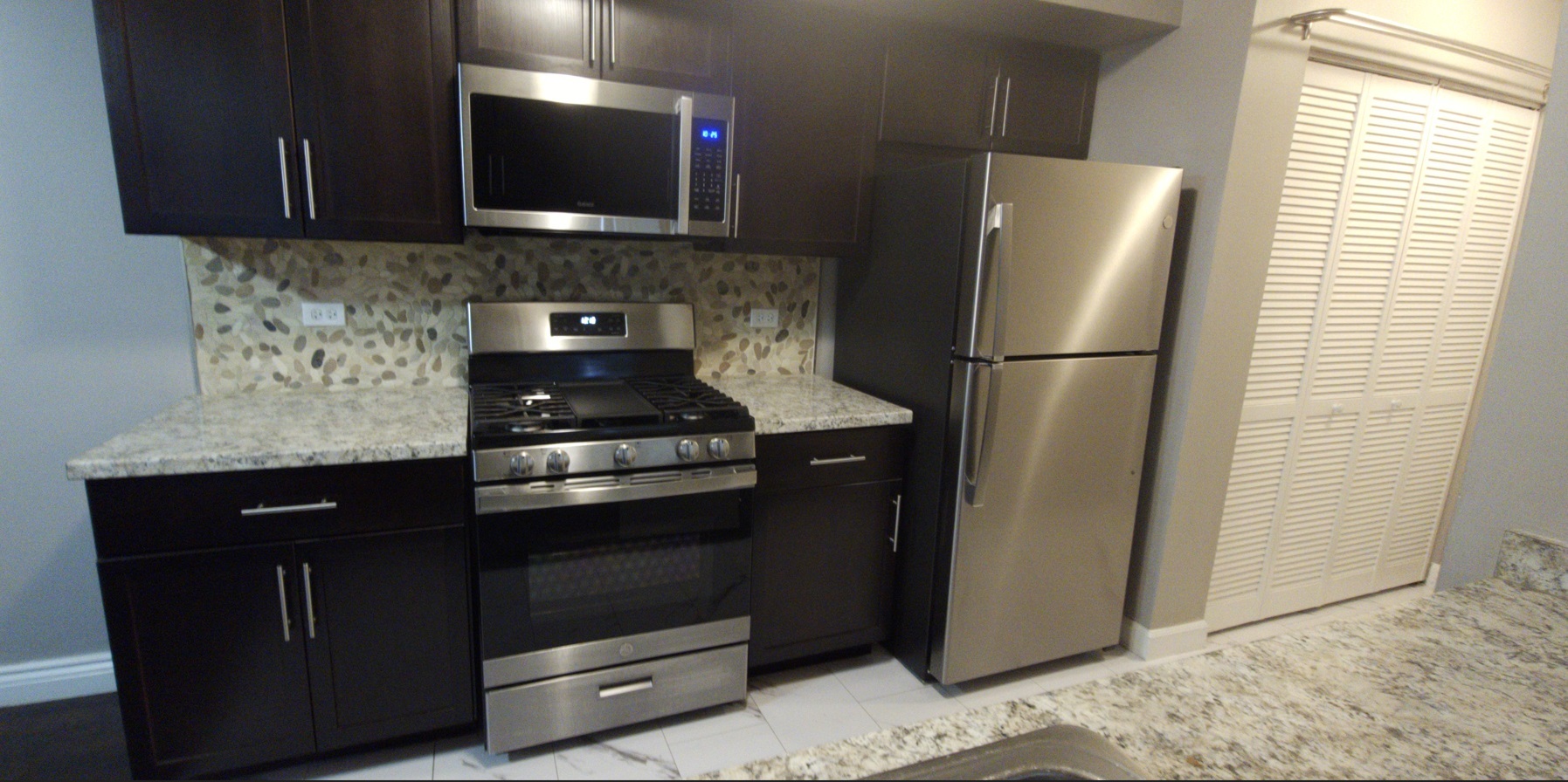 309 Teak Lane Streamwood, IL 60107 - Photo 7 of 16 a kitchen with a refrigerator stove and cabinets