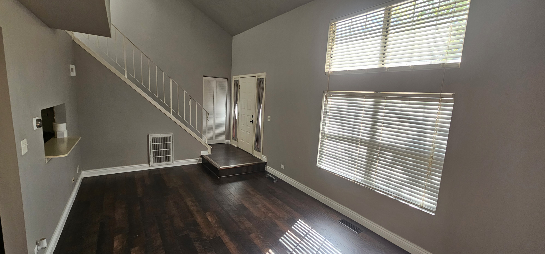 309 Teak Lane Streamwood, IL 60107 - Photo 9 of 16 a view of staircase with wooden floor and a window