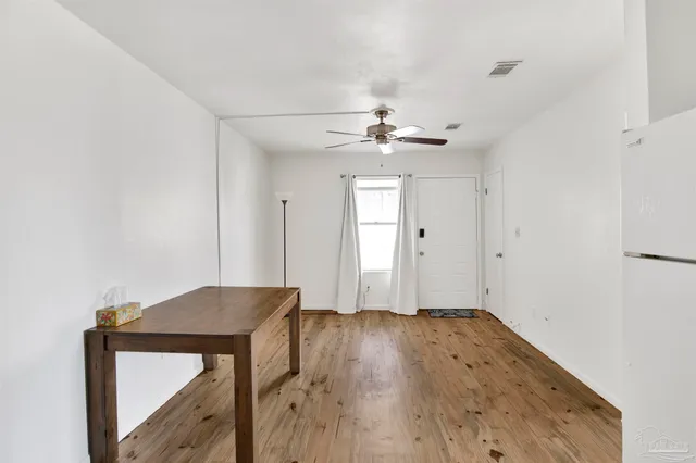 a view of entryway with wooden floor