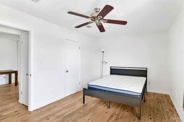 a living room with a bed furniture and a window