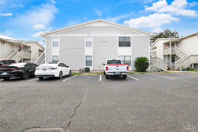 a view of car parked in front of house
