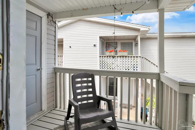 a view of a house with porch and wooden floor
